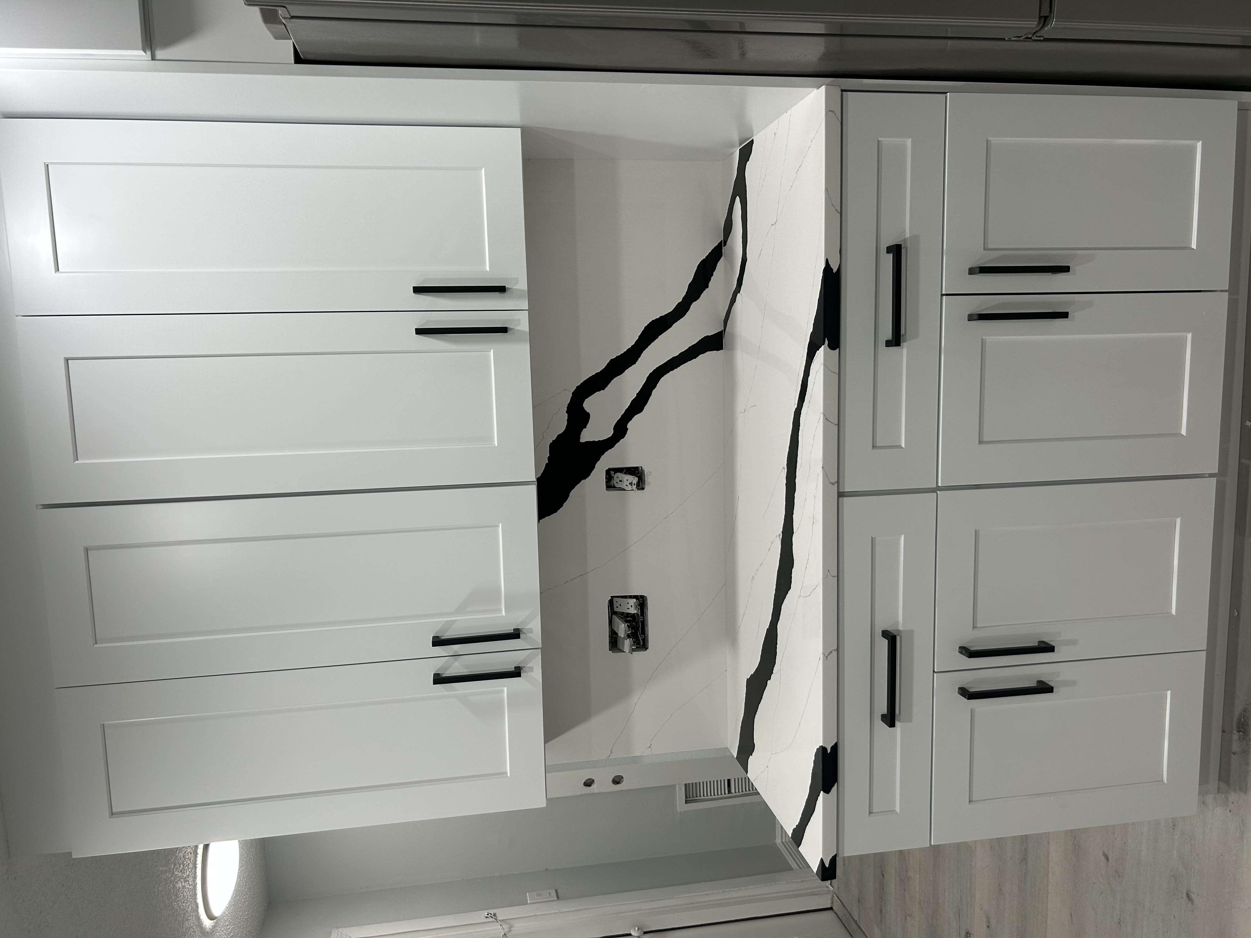 Black-and-white marble backsplash and countertop