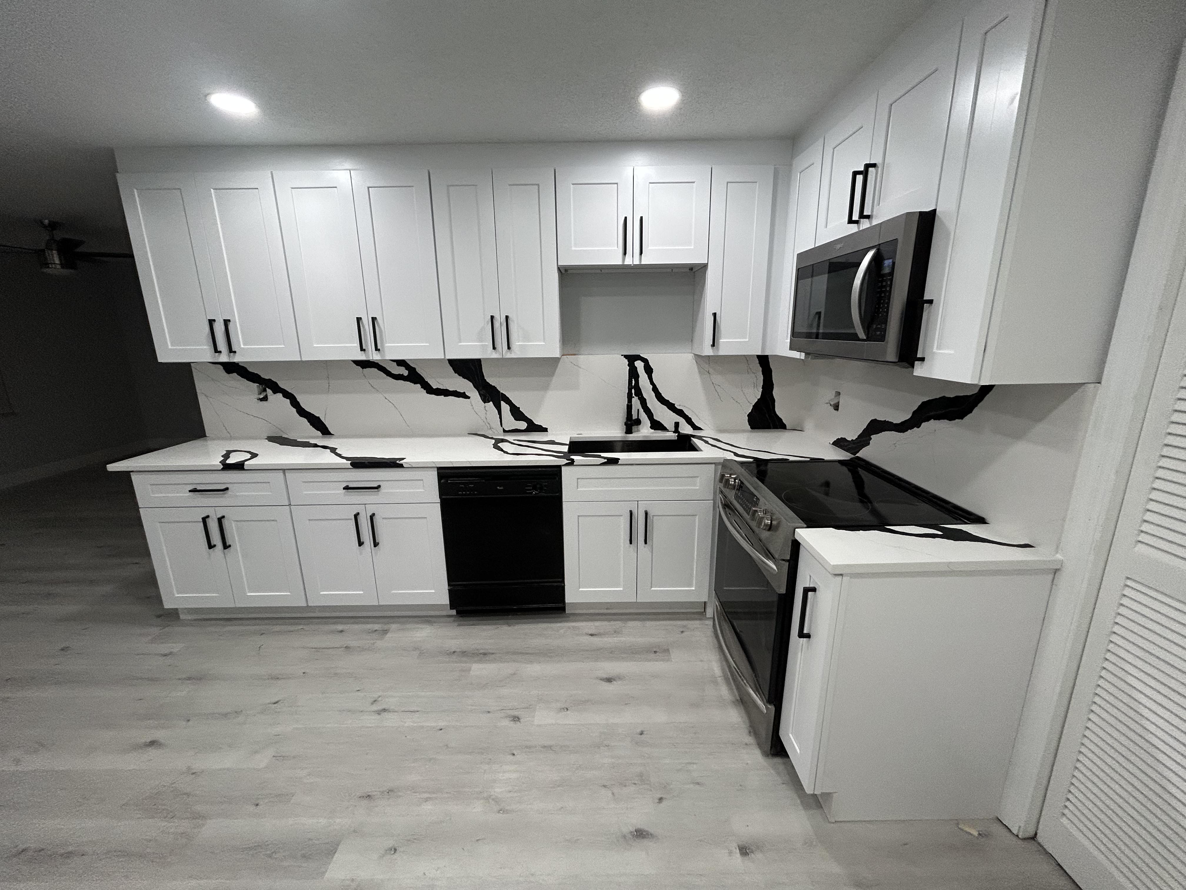 White kitchen with dramatic black veining